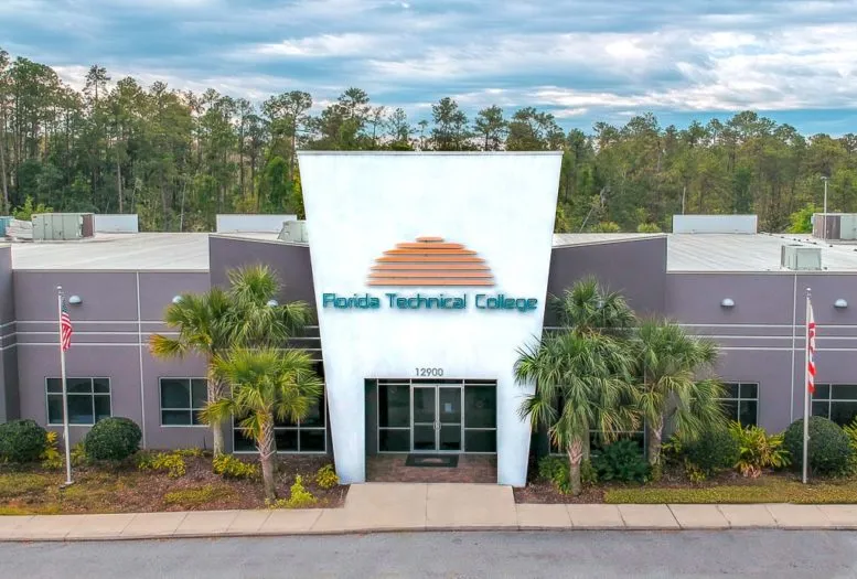 Front view of Northbridge University (formerly Florida Technical College) with palm trees under a blue sky
